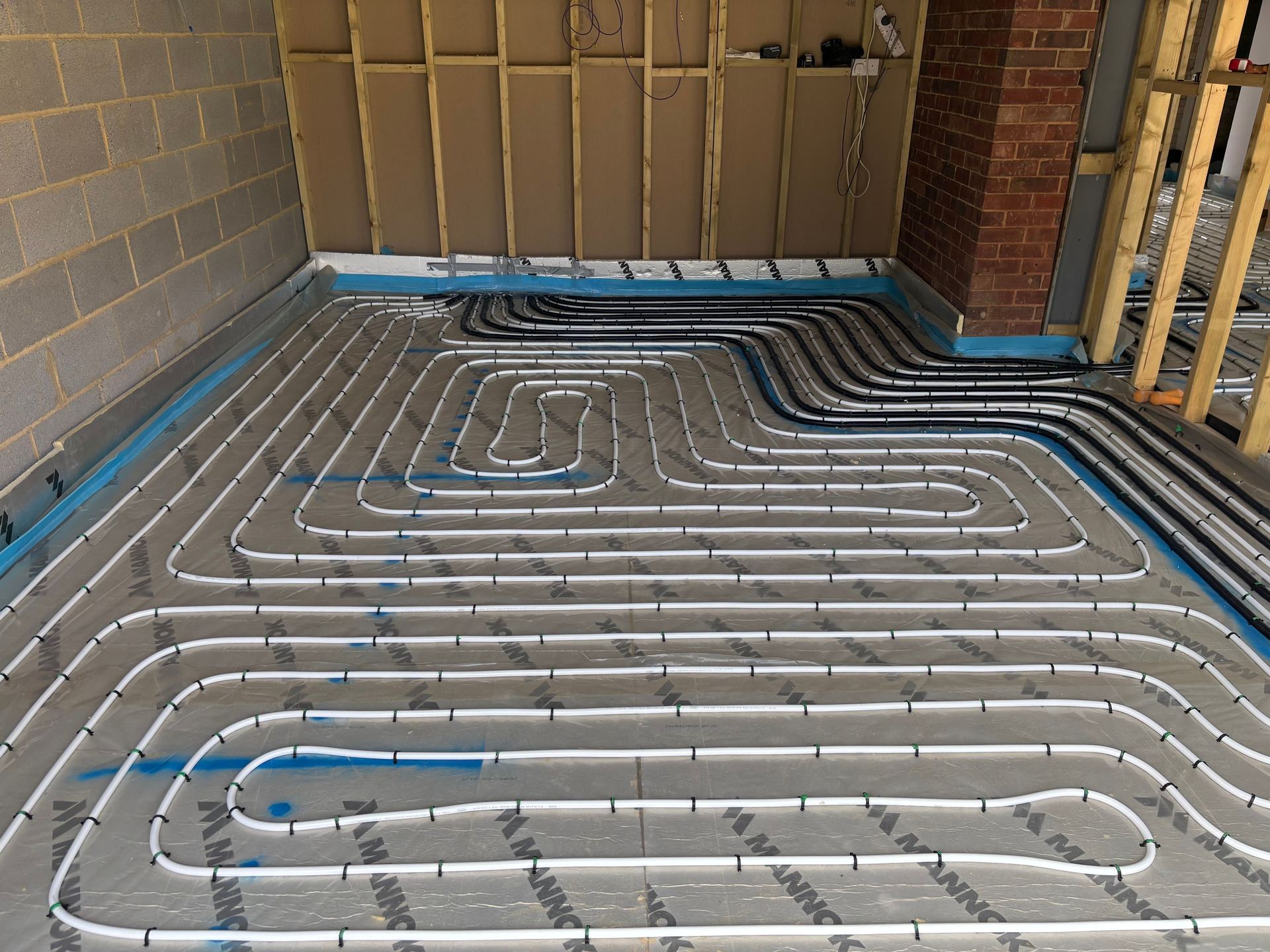 In-screed underfloor heating pipe laid across a new extension floor in Kent