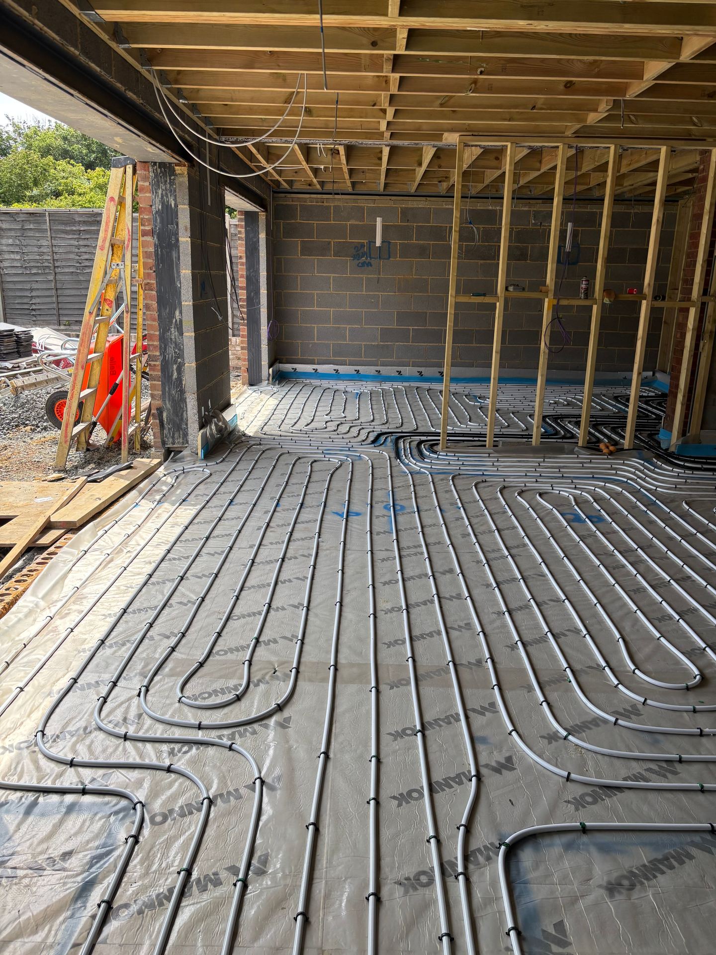 New build underfloor heating pipe laid right up to the patio doors