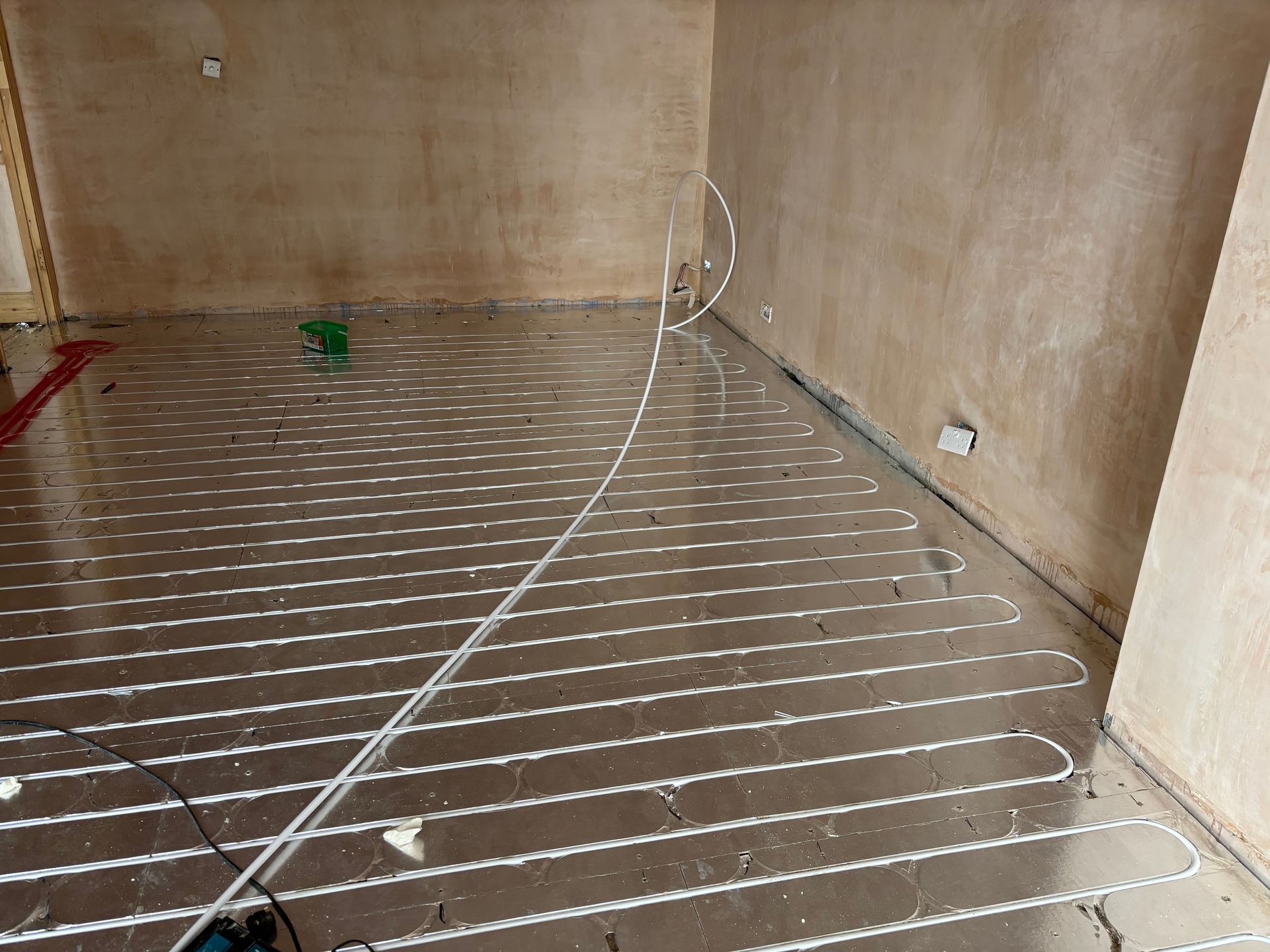 Pipe run into the grooved structural chipboard deck