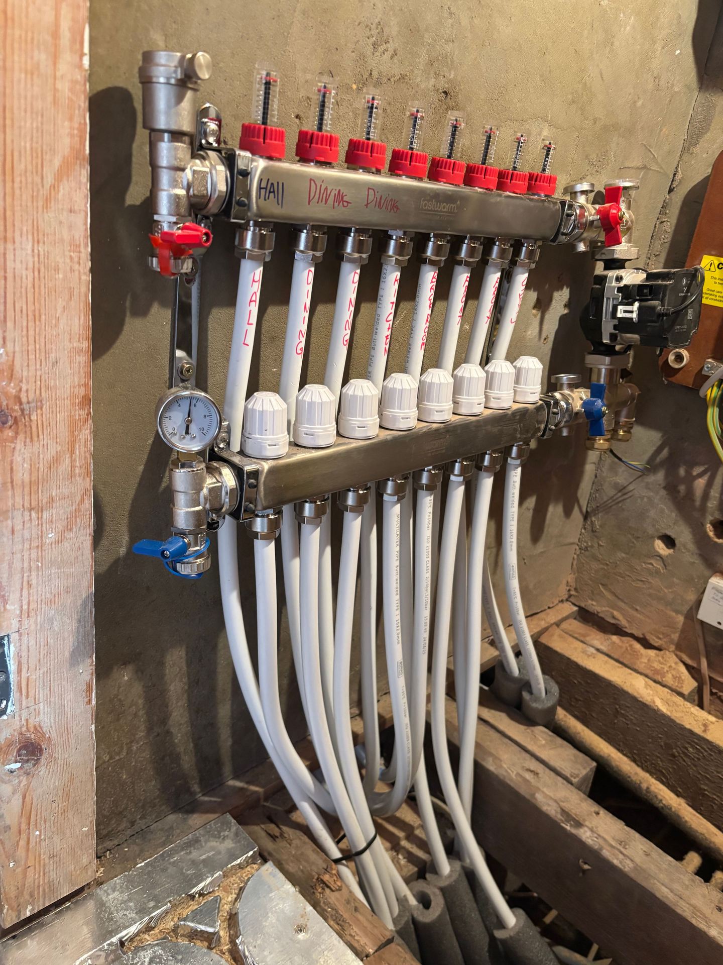 Underfloor heating manifold labelled up by zone